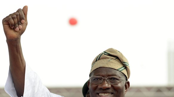 Struggling to face Boko Haram ... Nigerian President Goodluck Jonathan waves to supporters during a rally in Lago on Thursday.