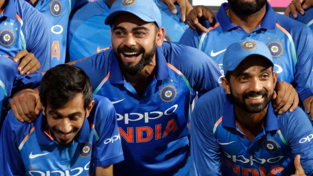 Indian cricket captain Virat Kohli (centre) and his side celebrate the series win over Australia.