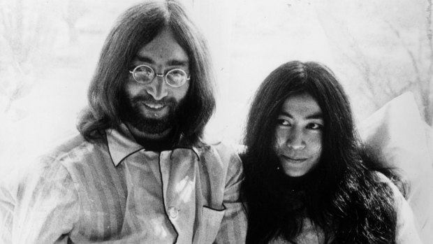 Rock 'n' roll singer, songwriter and guitarist John Lennon (1940 - 1980) of The Beatles with his wife of a week, artist Yoko Ono, in bed in the presidential suite of the Hilton Hotel in Amsterdam.