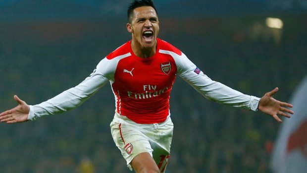 Ecstatic: Arsenal's Alexis Sanchez celebrates after scoring his sides second goal in their 2-0 victory over Borussia Dortmund in a Champions League group D match.
