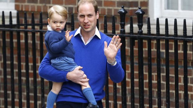 It's a girl: William, the Duke of Cambridge and his son Prince George wave outside St. Mary's Hospital's Lindo Wing on Saturday.