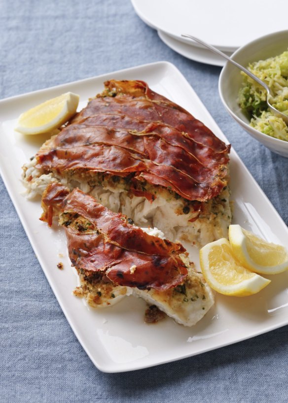 Roast fish with prosciutto and a side of buttered cabbage.