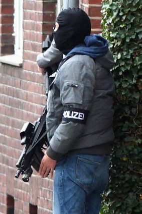 A German special police officer in Alsdorf on Tuesday.