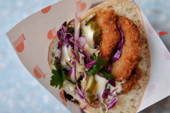 'Pitzi' pezzo filled with schnitzel, Italian slaw and pickles.