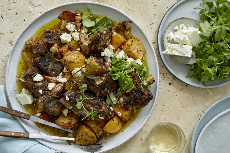 Slow-roasted lamb with potatoes, lemon, garlic and oregano.