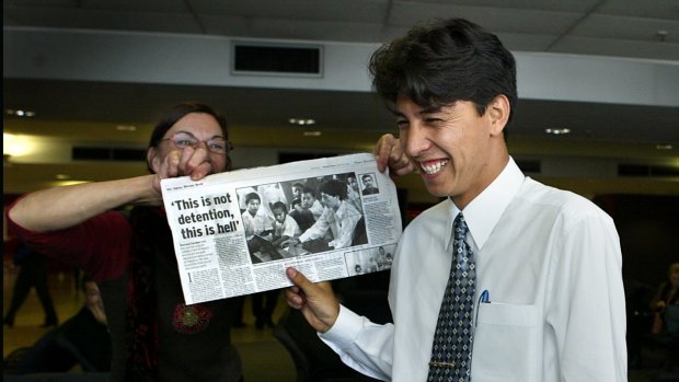 Ali Mullaie arrives in Australia in 2008, after three years of detention. He is greeted at the airport by Dorothy Babb, who wrote to him while he was in detention. Babb is holding a Michael Gordon story about Ali's plight published in 