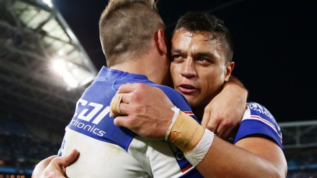 Bulldogs Josh Reynolds (left) and Sam Perrett celebrate victory over the Panthers during last year's finals.