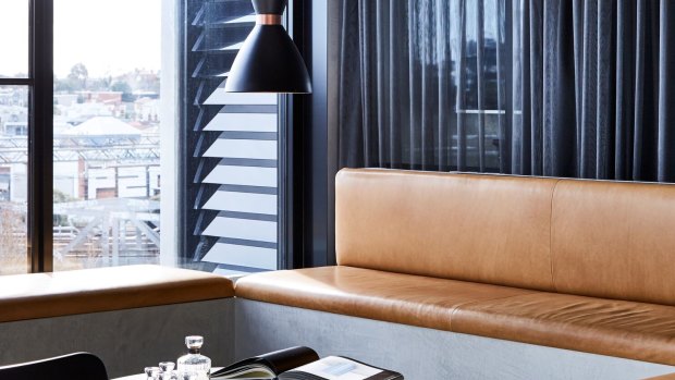 In situ-concrete seating with deep camel-coloured leather cushions at the Cremorne Street office.