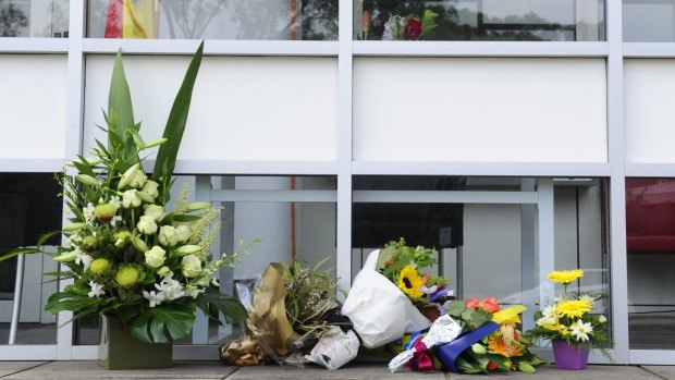 Floral tributes outside the embassy, where visitors can sign a condolence book. 