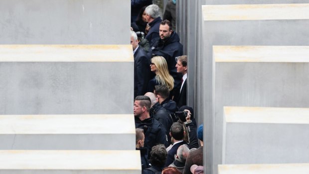 Ivanka Trump is surrounded by police and security as she visits the Memorial to the Murdered Jews of Europe, at the Holocaust Memorial in Berlin.