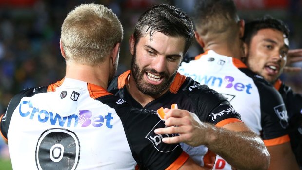 In demand: James Tedesco celebrates full time in Townsville.