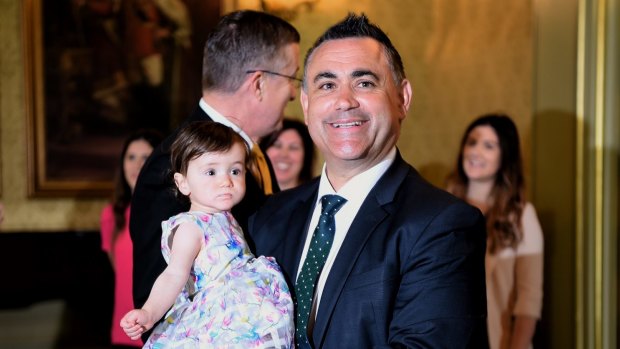 Leader of NSW National party John Barilaro holding his 1-year-old daughter Sofia Barilaro moments before being sworn in as NSW Deputy Premier at Government House.