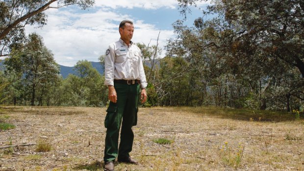 ACT parks and conservation service regional manager Brett McNamara stands at the site of his former house in Tidbinbilla, which was razed by the 2003 bushfires. 