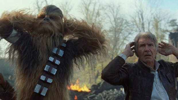 Still from Star Wars: The Force Awakens. Chewbacca (Peter Mayhew), and Han Solo (Harrison Ford).