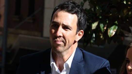 Tough time: Tom Cooper arrives at the inquest into the death of Phillip Hughes.