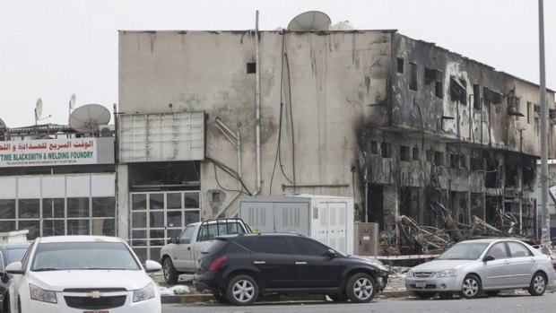 The charred remains of a building in an Abu Dhabi industrial zone where 10 migrant labours died.