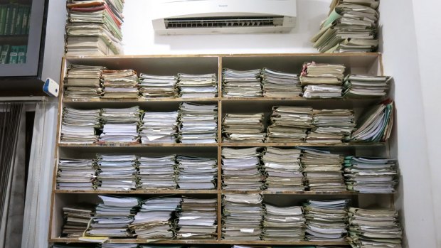 Many court files are not digitised, leading to huge stacks such as this one in a law office in Lucknow. 