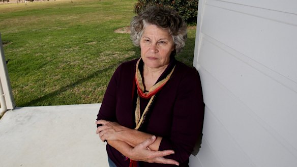 Denise Gilbert at her Forbesdale residence near Gloucester, which overlooks the proposed Rocky Hill coal mine, pictured in the background.
