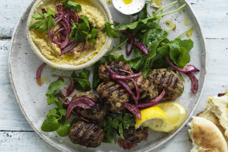 Neil Perry's lamb meatballs with onion salad and hummus.