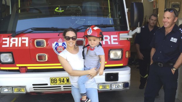 Happier times: Sonya and Rocco Heighington visit the fire station after Sunday's near miss.