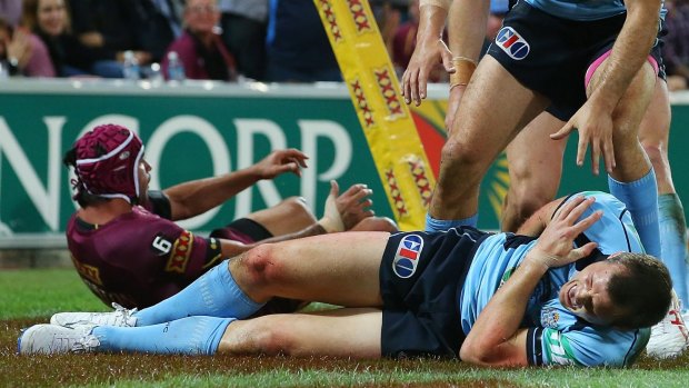 Brave display: Brett Morris played for more than an hour with a shoulder injury in game one of the 2014 Origin series.