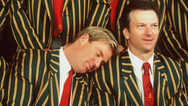 Shane Warne takes a snooze on the shoulder of teammate Steve Waugh in 1999.