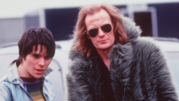 An earlier rock star role: with Hans Matheson in <i>Still Crazy</i>.