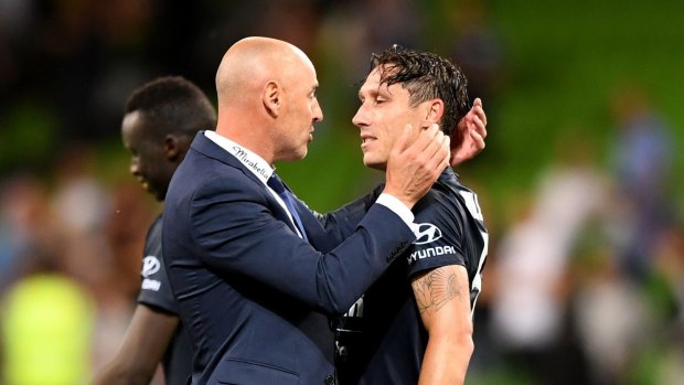 Coach Kevin Muscat has a word with Milligan.