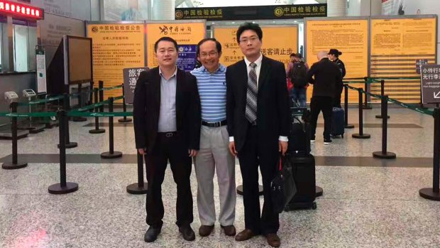 Professor Feng Chongyi at the Guangzhou Airport on Saturday with his lawyers Chen Jingxue, left, and Liu Hao , after being questioned by police.