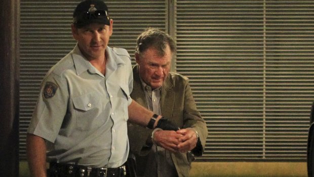 Murderer Ian Turnbull is escorted out of court during the trial.