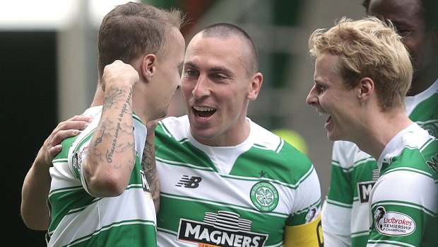 On target: Celtic's Leigh Griffiths, left, celebrates scoring with Scott Brown and Stuart Armstrong.
