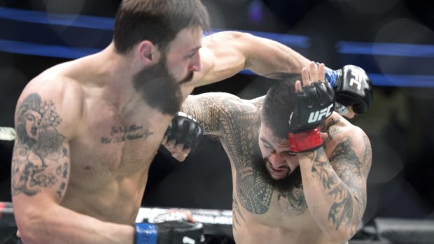 Undefeated: Tyson Pedro, right, ducks under a punch from Paul Craig in his victory back in March.