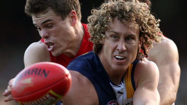 Matt Priddis of the Eagles handballs during the match between the Eagles and the Sydney Swans in Perth.