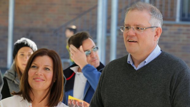 Treasurer Scott Morrison casts his vote with wife Jenny on Saturday.