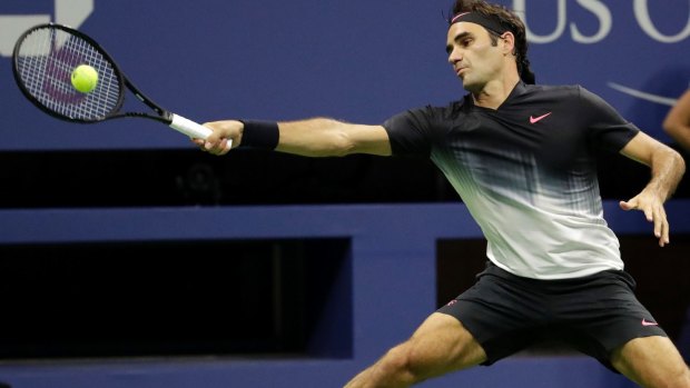 Stretched: Roger Federer dropped two sets before moving into the second round of the US Open.