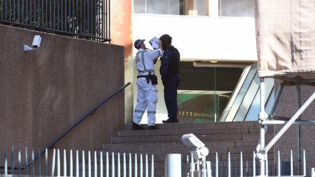 Officers from the bomb squad attend NSW Parliament House after reports of a suspicious package found near the building.