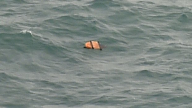 A photo taken from an Indonesian search and rescue aircraft over the Java Sea of debris from AirAsia flight QZ8501.