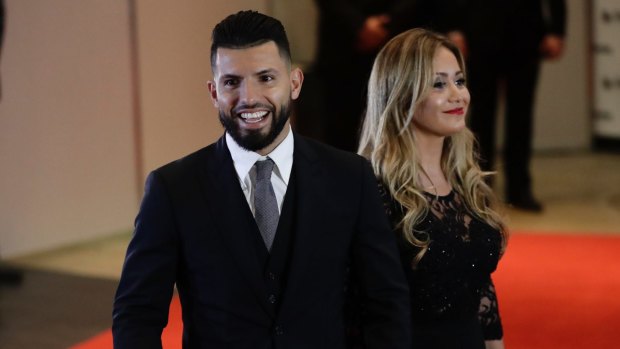 Manchester City striker Sergio Aguero and his girlfriend Karina Tejeda arrive to attend the wedding of Lionel Messi and Antonella Roccuzzo, in Rosario, Argentina, on Friday.