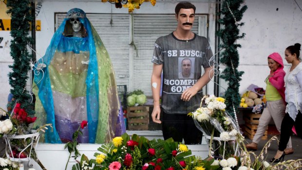 A street shrine with statues representing the folk saint known in Mexico as Santa Muerte or Death Saint.