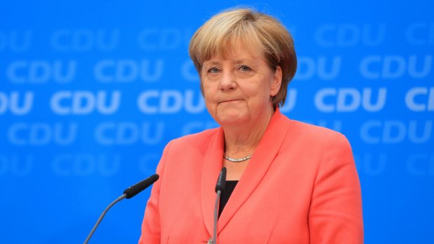 Angela Merkel at a news conference following the CDU's heavy losses.