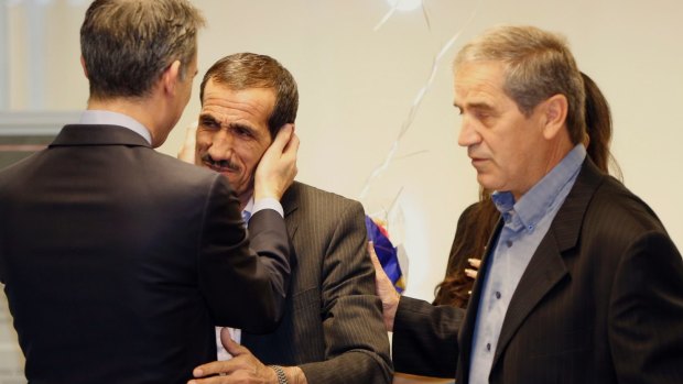 Los Angeles mayor Eric Garcetti, left, hugs Ali Vayeghan, an Iranian citizen with a valid US visa, as he is welcomed by his brother Houssein.