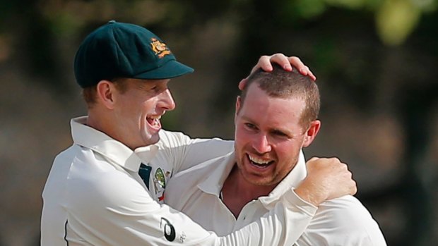Reward: Jon Holland enjoys a wicket during the recent Test series against Sri Lanka.