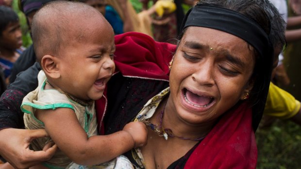 A Rohingya woman after a fight erupted during food distribution at a refugee camp in Kutupalong, Bangladesh