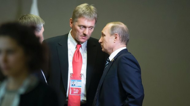 Russian President Vladimir Putin, right, speaks to his press secretary Dmitry Peskov in November, 2015.
