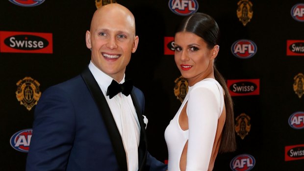 Gary Ablett poses with partner Jordan Papalia before the 2015 AFL Brownlow Medal count.