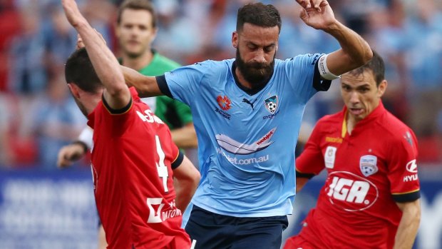 On the run: Alex Brosque tears through the Adelaide United defence on Boxing Day.