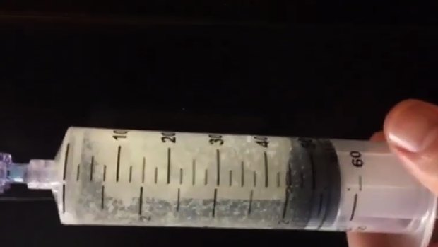 An undated Georgia Department of Corrections image of a syringe loaded with a lethal injection drug. 