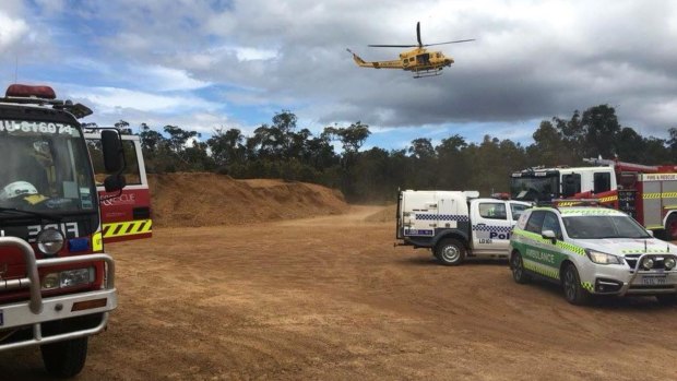 Emergency services convening on the crash site yesterday morning.