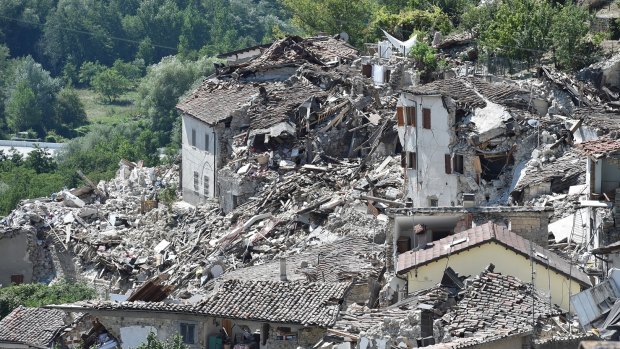 Rubble surrounds damaged buildings on August 25 in Pescara del Tronto, Italy. 