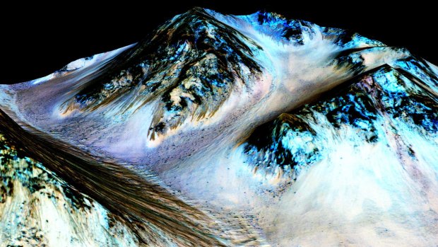 A photo from NASA's Mars Reconnaissance Orbiter shows the dark, narrow streaks on the surface of Mars. 